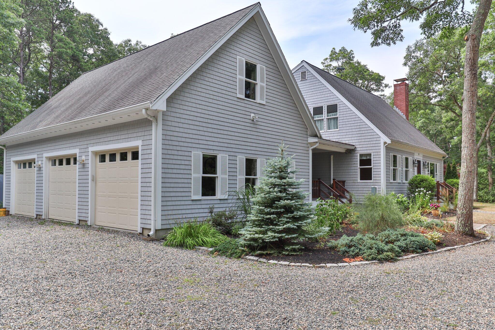 565 Sampsons Mill Road Cotuit, MA 02635 - Photo 80 of 87 a view of a house with a yard and plants