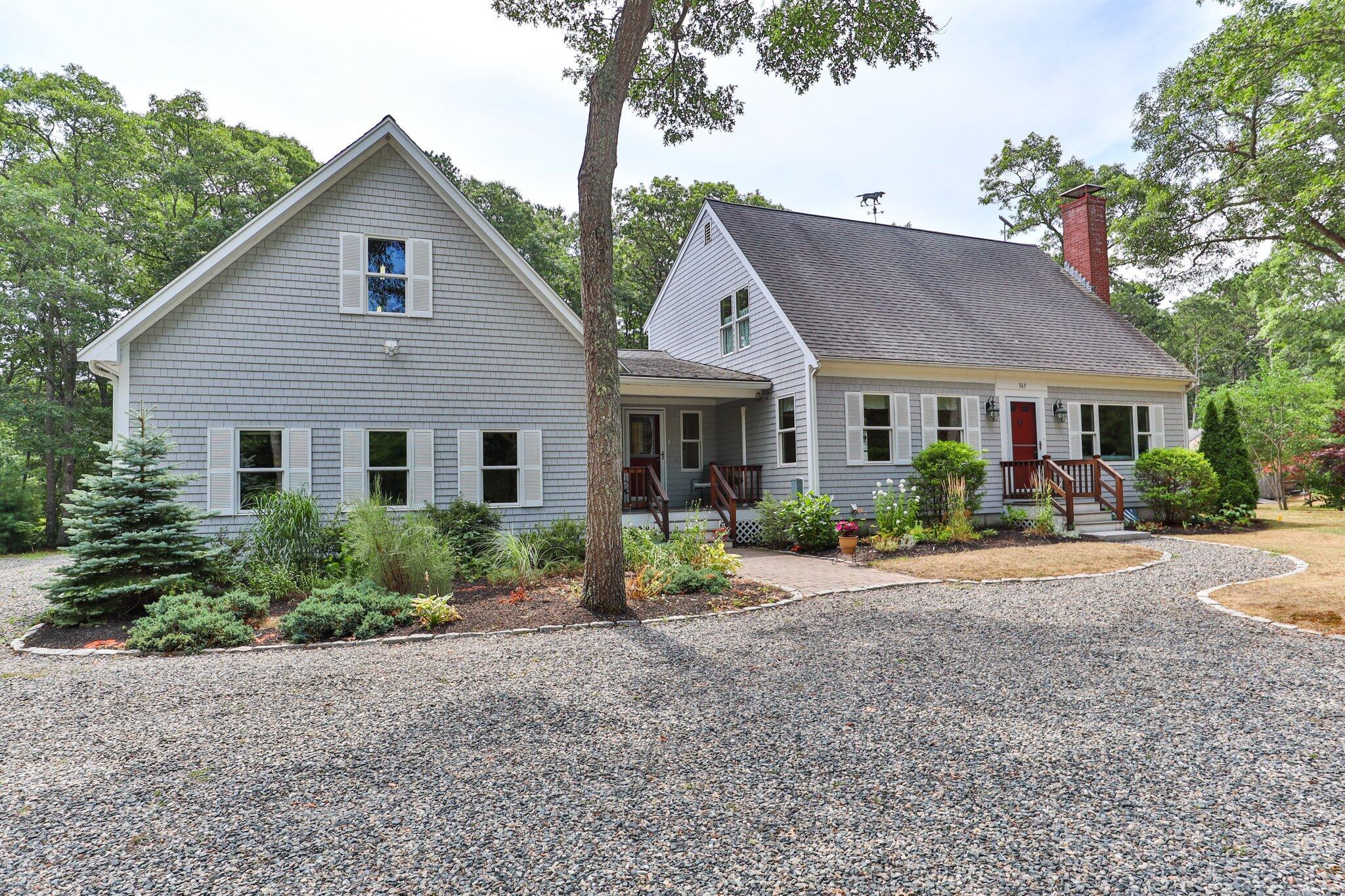 565 Sampsons Mill Road Cotuit, MA 02635 - Photo 81 of 87 a front view of a house with garden