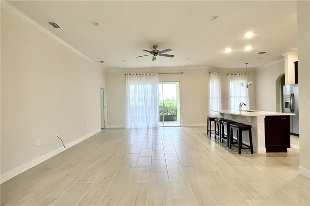 a view of a kitchen and dining room