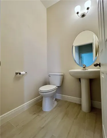 a bathroom with a toilet and sink