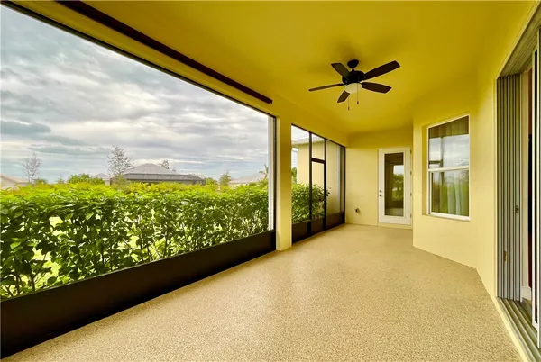 view of a bathroom with a glass door shower and a sink