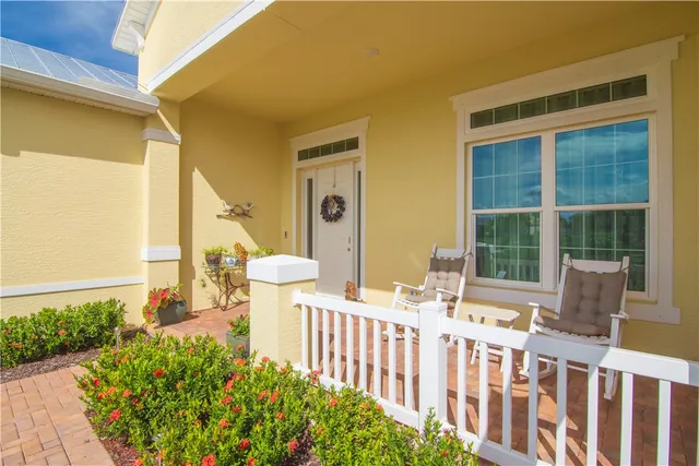 a front view of a house with a fountain