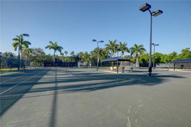 a view of a park with swings and slides