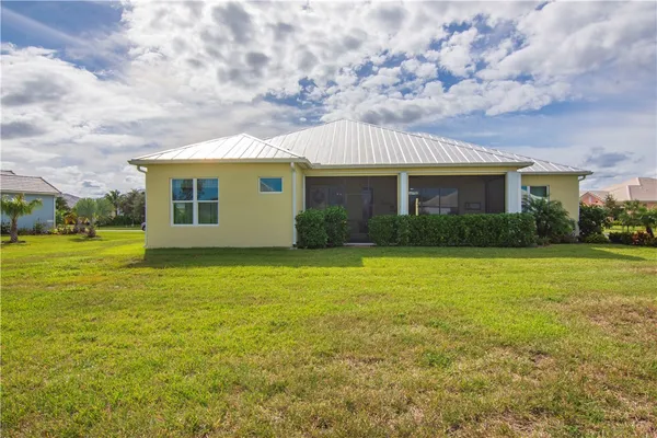 a view of a house with a garden