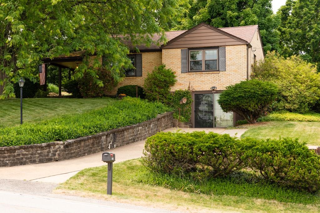 8125 Peebles Road Pittsburgh, PA 15237 - Photo 1 of 22 a front view of a house with garden
