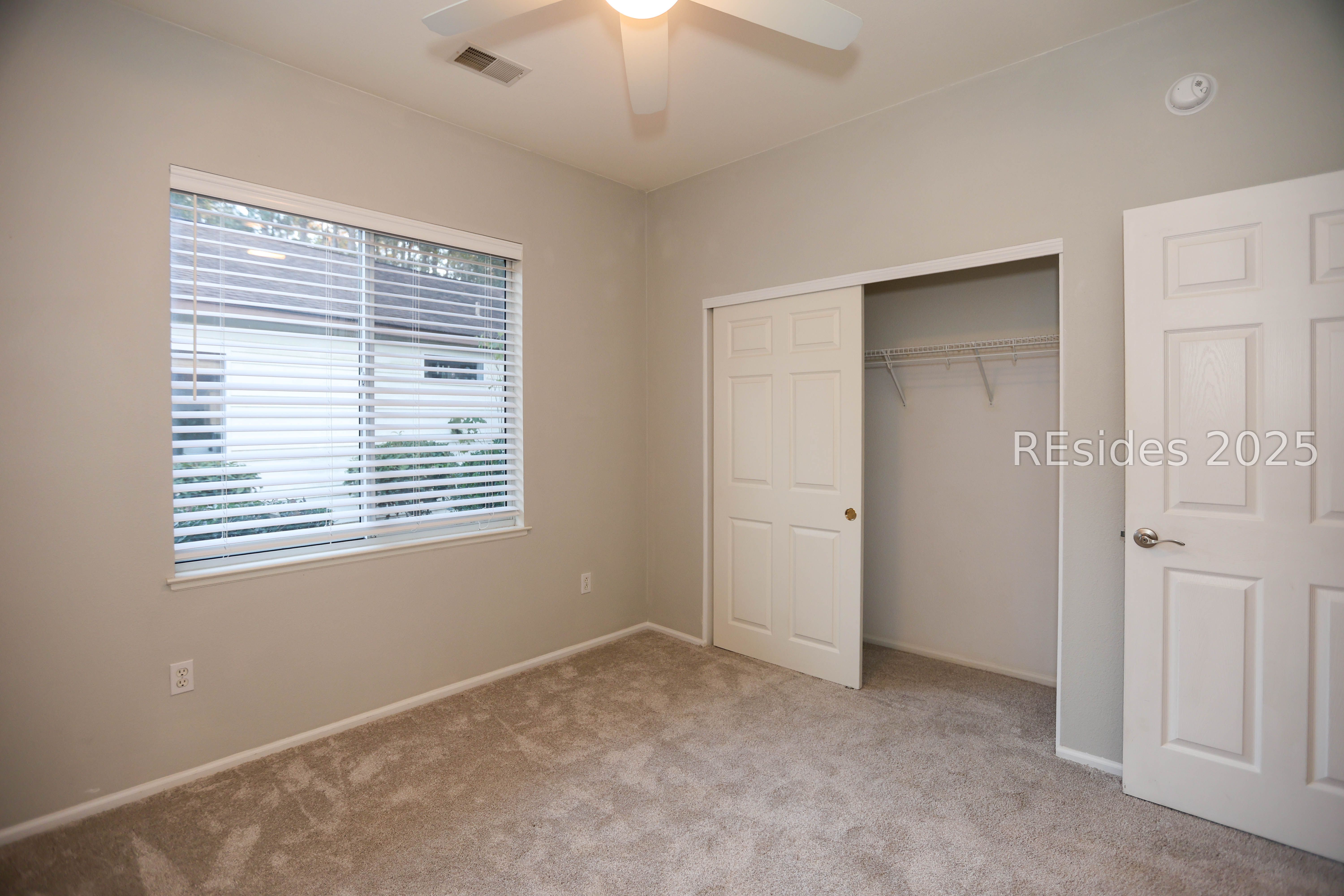 14 Andover Place Bluffton, SC 29909 - Photo 29 of 64 Bedroom 2 un-staged shows double closet