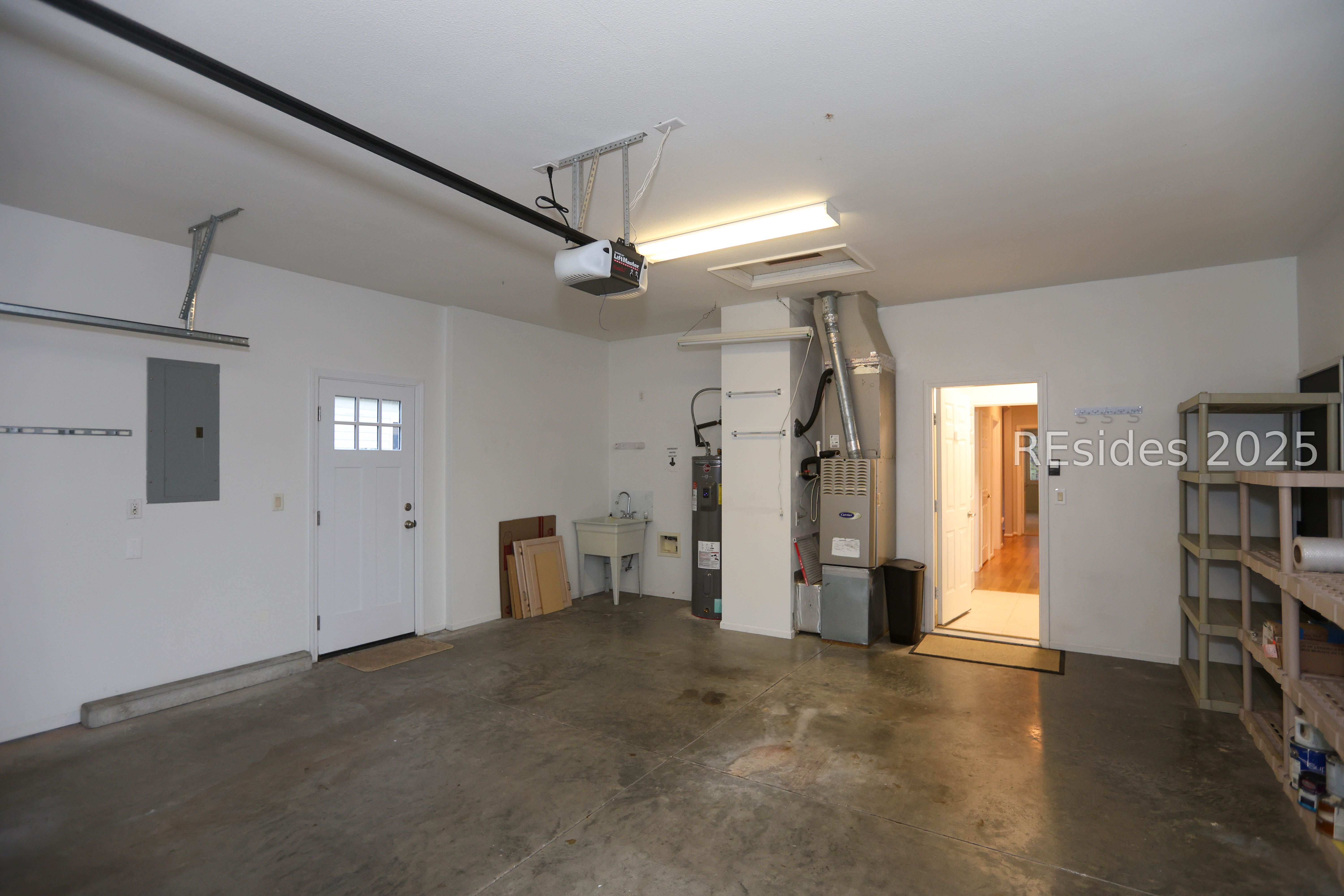 14 Andover Place Bluffton, SC 29909 - Photo 38 of 64 Garage has utility sink & Kitchen cabinet doors
