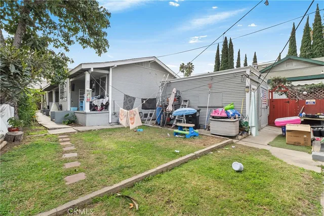 a view of a house with backyard porch and sitting area