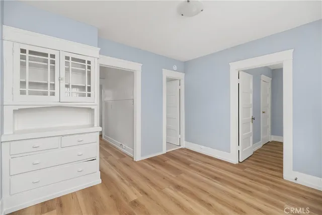 a view of room with wooden floor