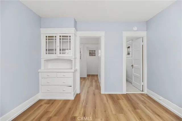 a view of room with wooden floor