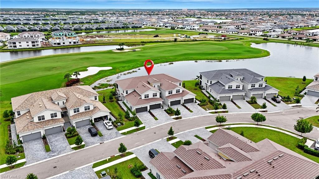 5667 Melbourne Court, Unit 7812 Ave Maria, FL 34142 - Photo 1 of 49 an aerial view of a city with lots of residential buildings ocean and ocean view