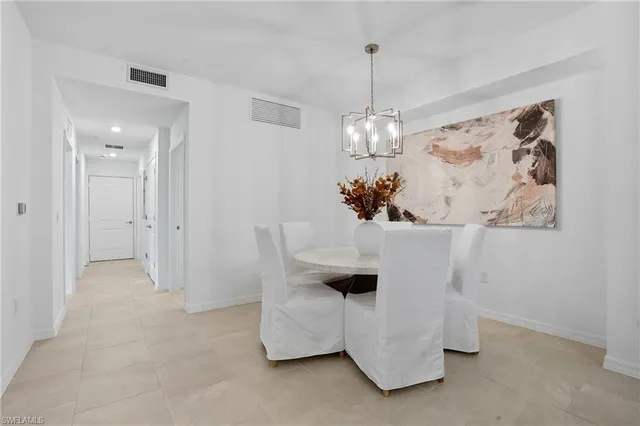 a view of living room with furniture and chandelier