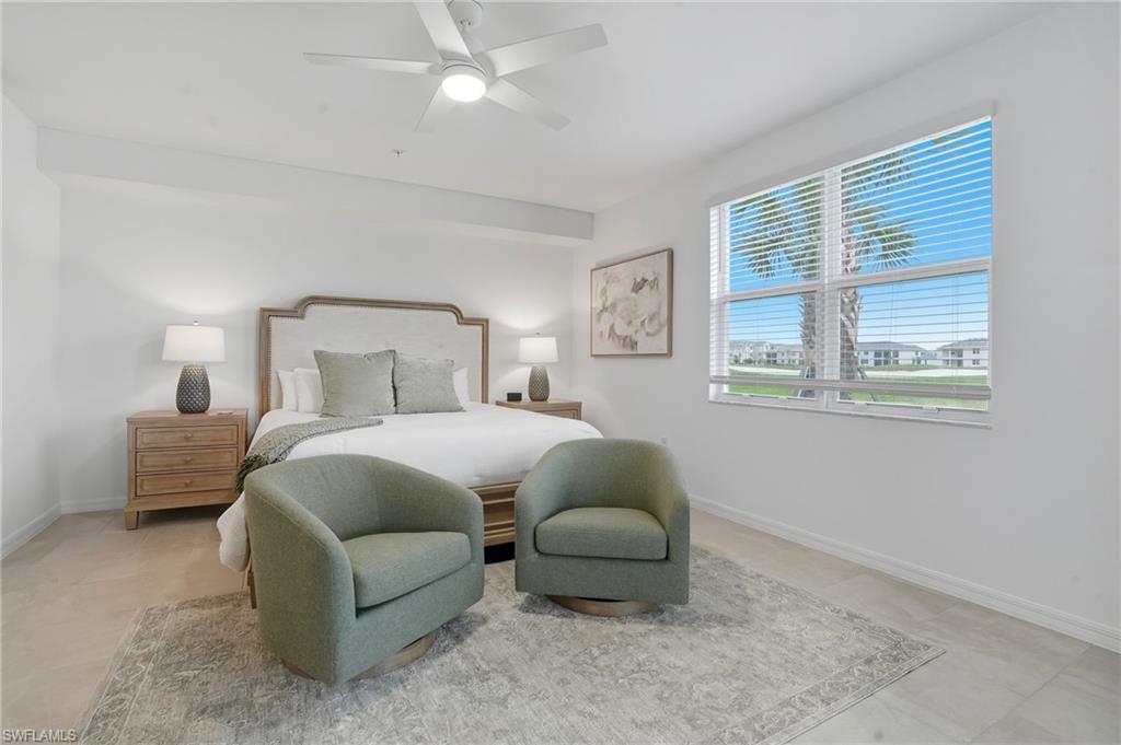 5667 Melbourne Court, Unit 7812 Ave Maria, FL 34142 - Photo 18 of 49 a bedroom with a bed and a window