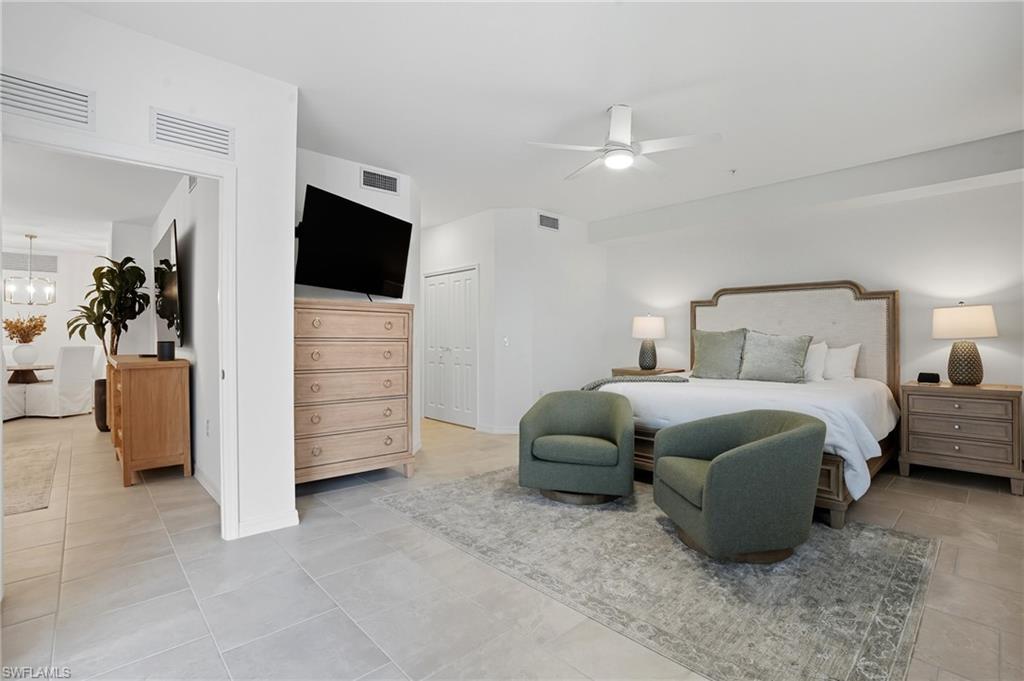 5667 Melbourne Court, Unit 7812 Ave Maria, FL 34142 - Photo 20 of 49 a bedroom with a bed and a television