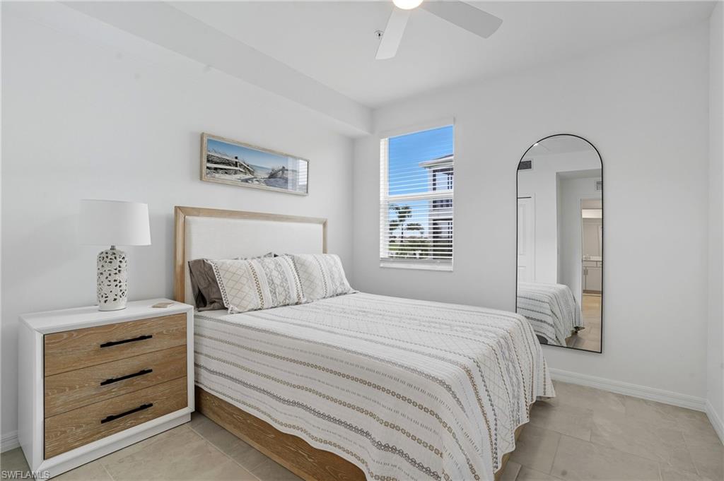 5667 Melbourne Court, Unit 7812 Ave Maria, FL 34142 - Photo 24 of 49 a bedroom with a bed and a window