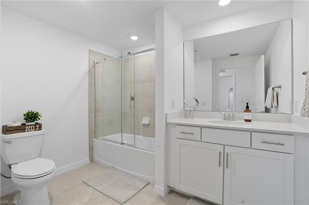 5667 Melbourne Court, Unit 7812 Ave Maria, FL 34142 - Photo 28 of 49 a bathroom with a toilet sink and shower