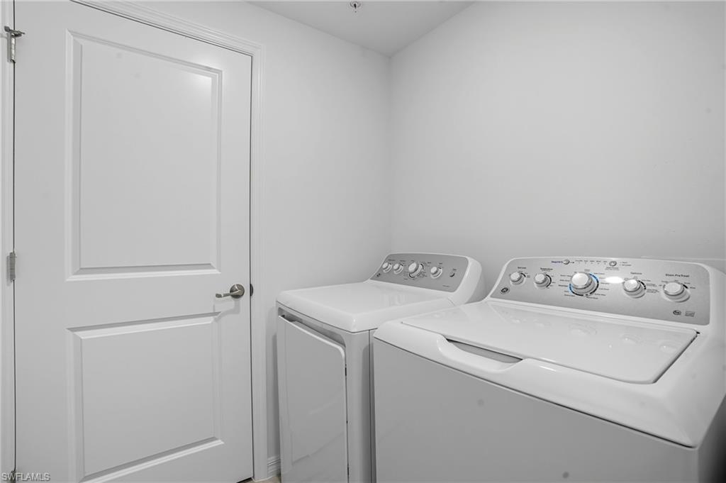 5667 Melbourne Court, Unit 7812 Ave Maria, FL 34142 - Photo 30 of 49 a utility room with dryer and washer
