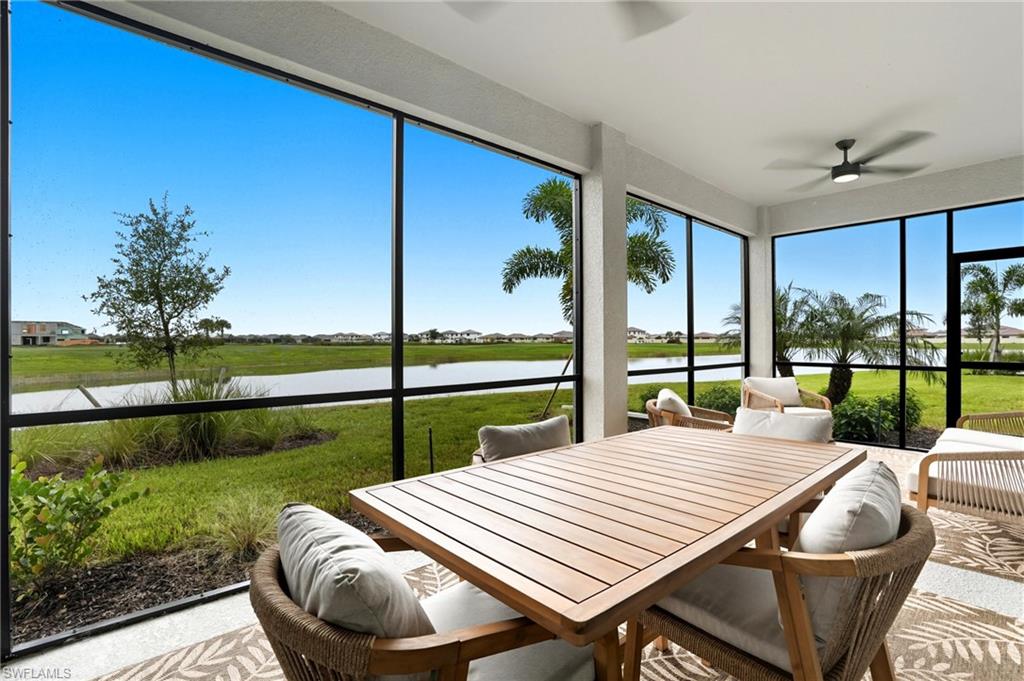 5667 Melbourne Court, Unit 7812 Ave Maria, FL 34142 - Photo 32 of 49 a view of a patio with swimming pool and furniture
