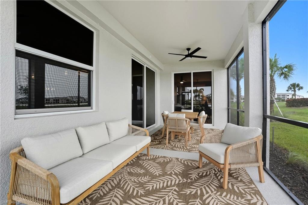 5667 Melbourne Court, Unit 7812 Ave Maria, FL 34142 - Photo 37 of 49 a living room with furniture and a flat screen tv