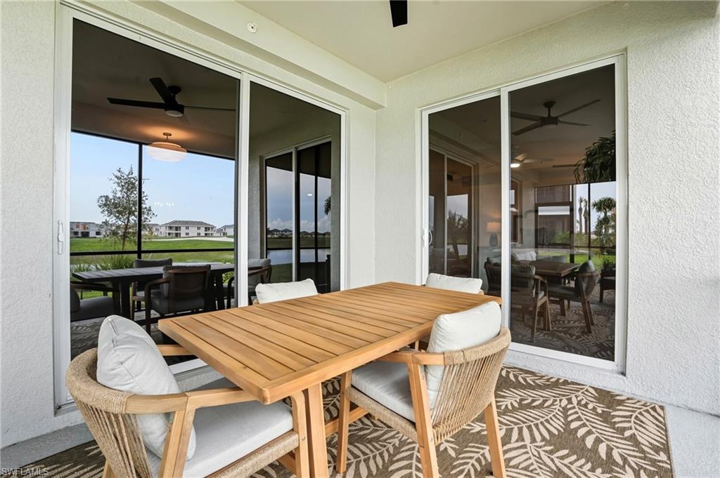 5667 Melbourne Court, Unit 7812 Ave Maria, FL 34142 - Photo 38 of 49 a dining room with furniture and window