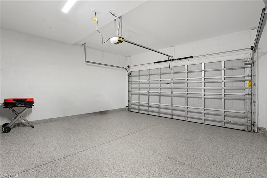 5667 Melbourne Court, Unit 7812 Ave Maria, FL 34142 - Photo 39 of 49 a view of a garage room and hardwood floor