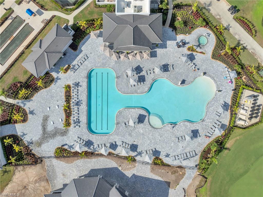 5667 Melbourne Court, Unit 7812 Ave Maria, FL 34142 - Photo 45 of 49 an aerial view of a house with garden