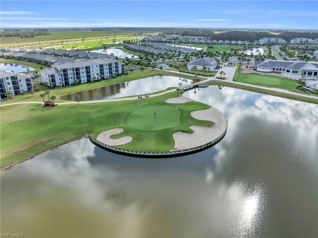 5667 Melbourne Court, Unit 7812 Ave Maria, FL 34142 - Photo 47 of 49 a view of a swimming pool with a lake view