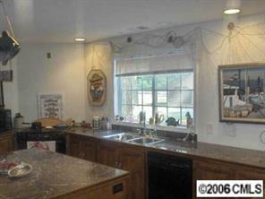 3907 Plyler Mill Road Monroe, NC 28112 - Photo 5 of 8 a kitchen with a sink and a window