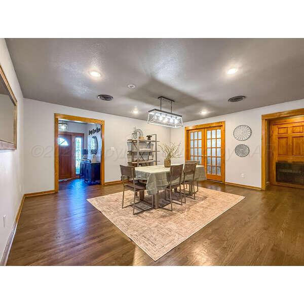 933 Elmore Street Borger, TX 79007 - Photo 22 of 53 a living room with furniture and wooden floor