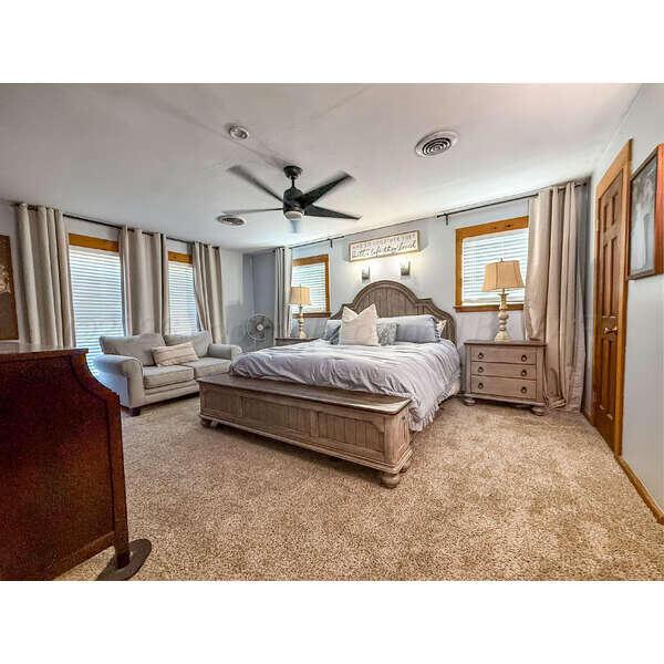 933 Elmore Street Borger, TX 79007 - Photo 31 of 53 a living room with a bed furniture and a large window