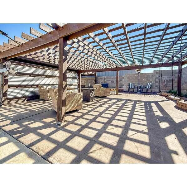 933 Elmore Street Borger, TX 79007 - Photo 45 of 53 a picture of a table and chairs on the roof deck