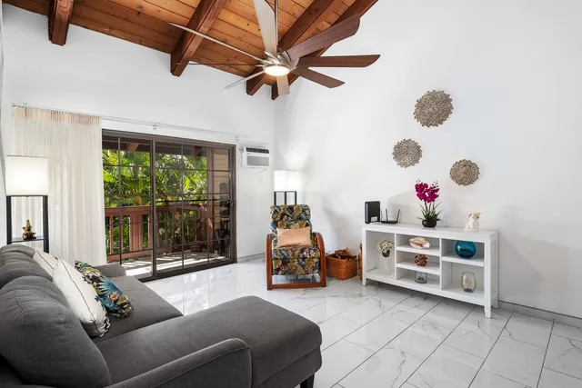 a bedroom with furniture and a chandelier
