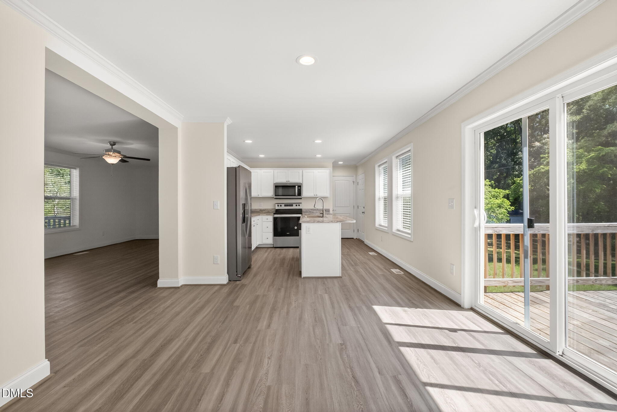 7122 Guess Road Hillsborough, NC 27278 - Photo 11 of 48 a view of a kitchen with wooden floor and a refrigerator