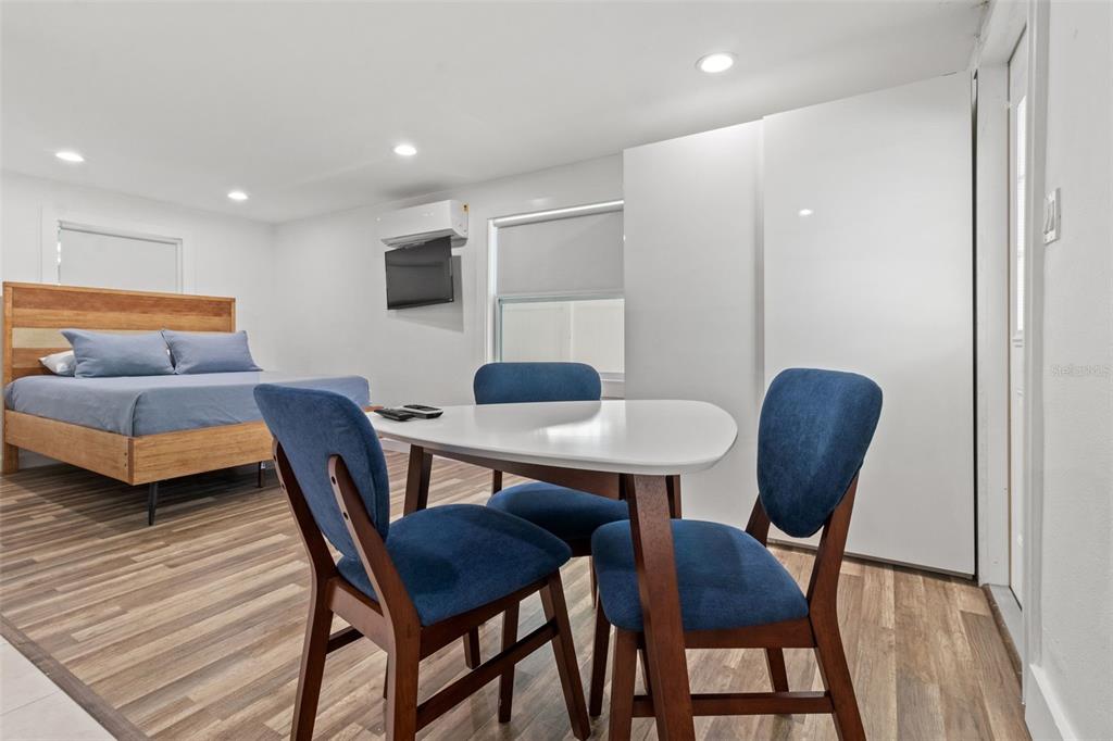609 North Osceola Avenue Clearwater, FL 33755 - Photo 29 of 47 a view of a dining room with furniture and wooden floor