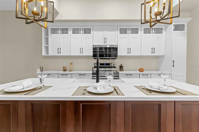 a kitchen with a sink stove and cabinets