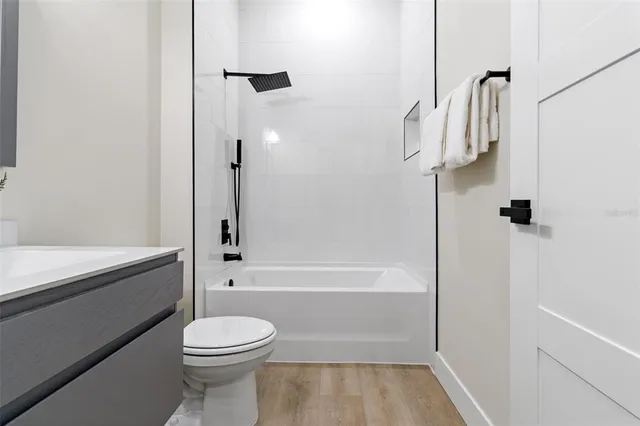 a bathroom with a sink a toilet and a bathtub