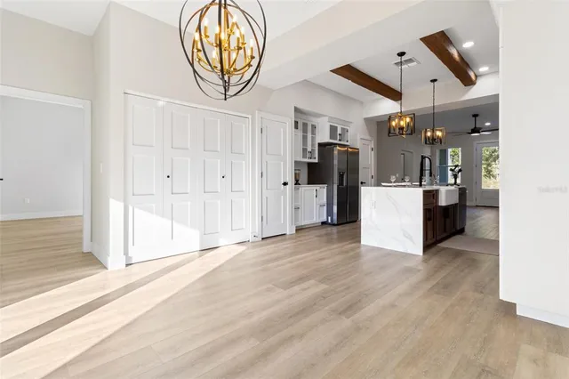 a view of a kitchen with wooden floor