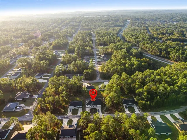 an aerial view of city and lake
