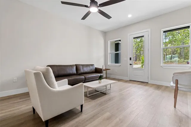 a living room with furniture and a window