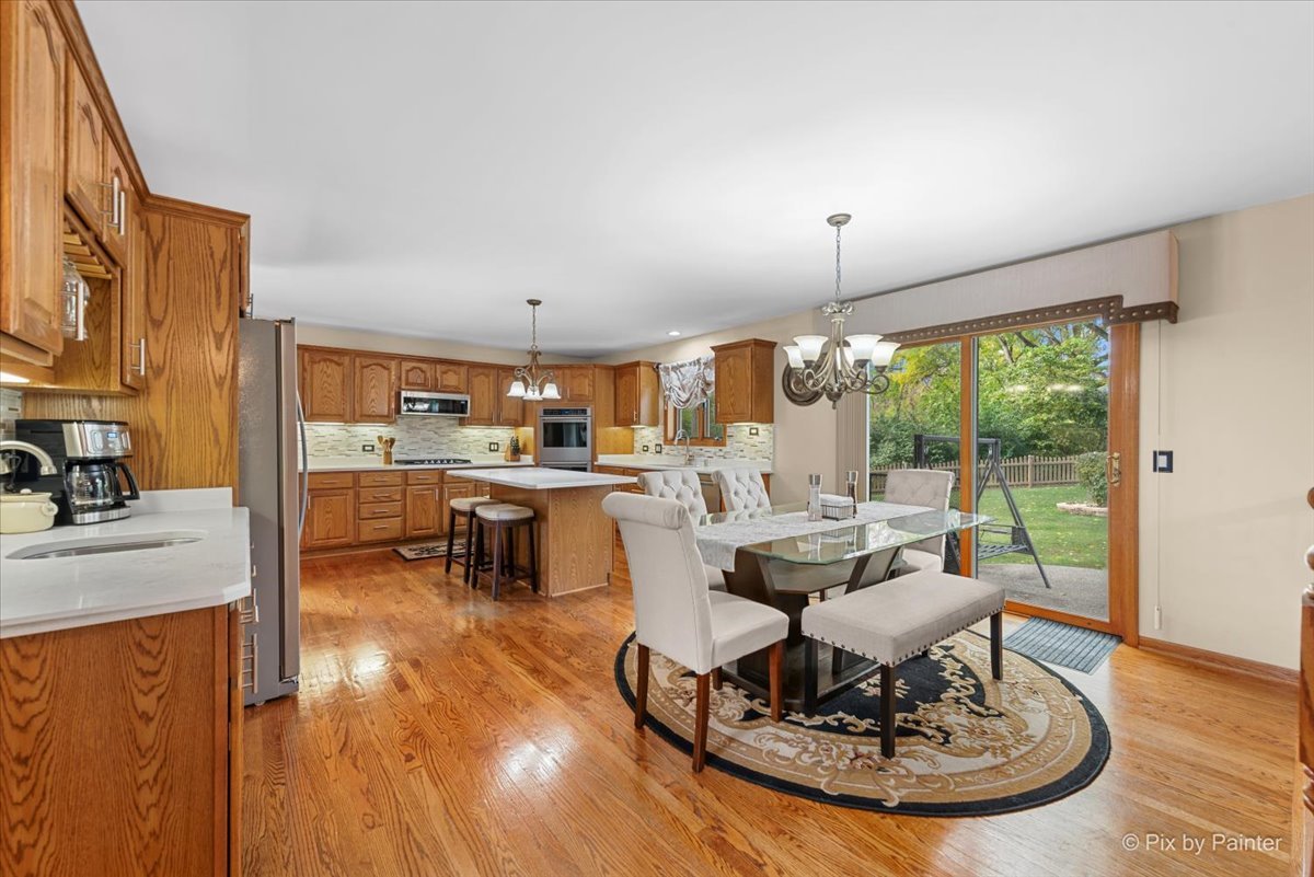 7203 Edgewood Court Spring Grove, IL 60081 - Photo 11 of 46 a living room with fireplace furniture and a large window