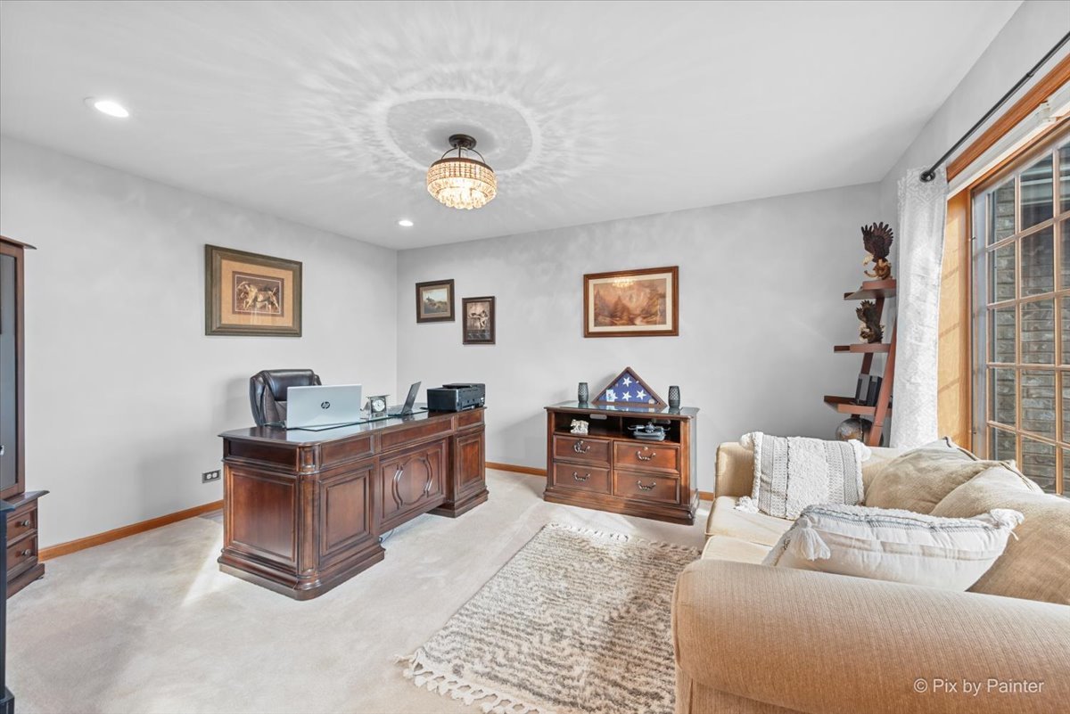 7203 Edgewood Court Spring Grove, IL 60081 - Photo 15 of 46 a living room with furniture and paintings on the wall