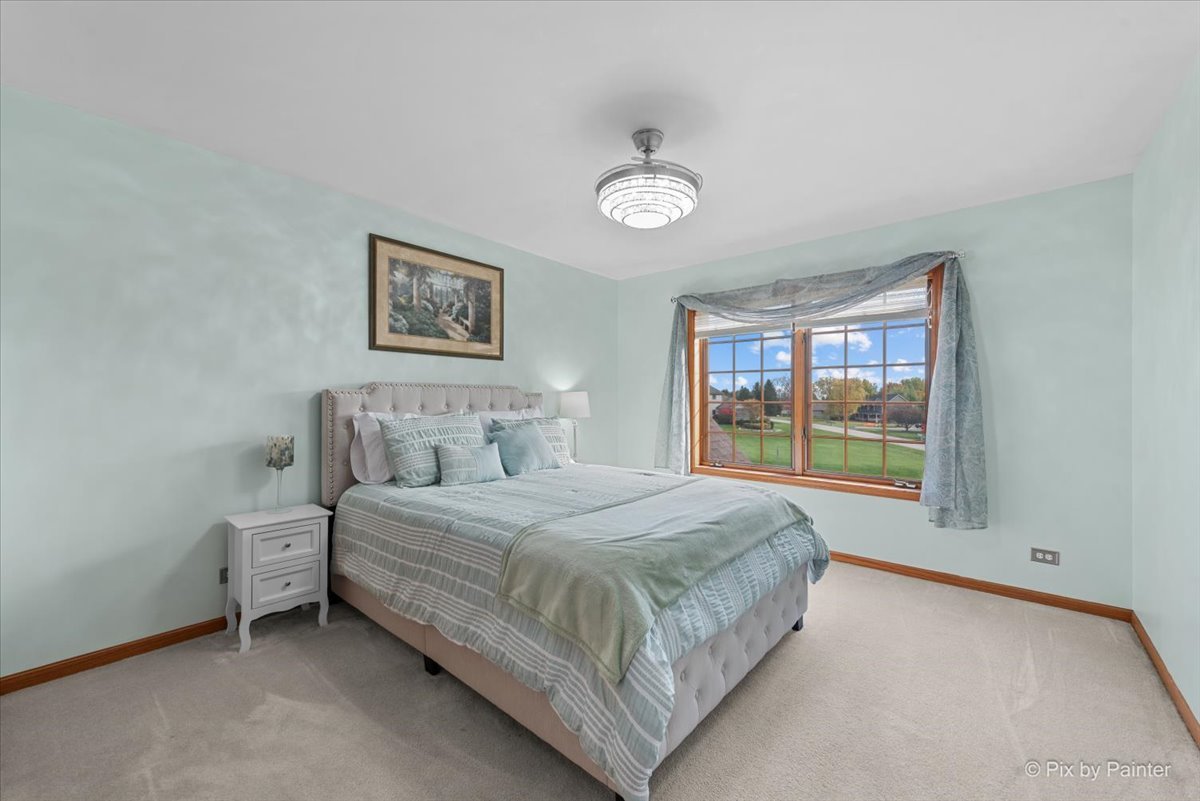 7203 Edgewood Court Spring Grove, IL 60081 - Photo 20 of 46 a bedroom with a bed and window