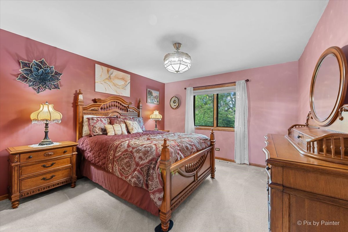 7203 Edgewood Court Spring Grove, IL 60081 - Photo 23 of 46 a bedroom with a bed and a window