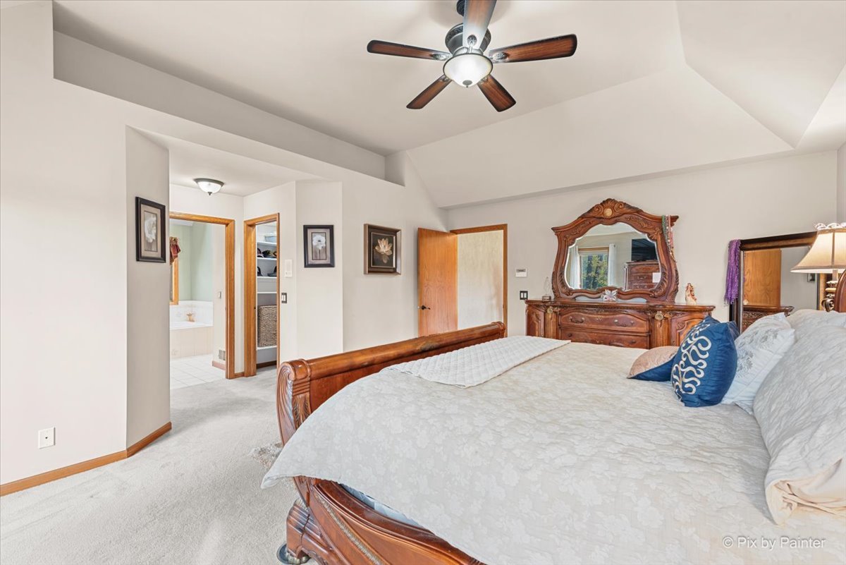 7203 Edgewood Court Spring Grove, IL 60081 - Photo 26 of 46 a bedroom with a bed dresser and a window