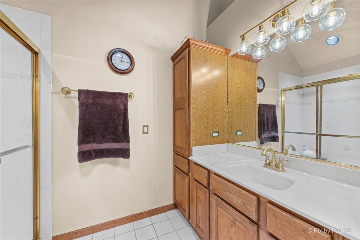 7203 Edgewood Court Spring Grove, IL 60081 - Photo 31 of 46 a bathroom with a sink and a mirror