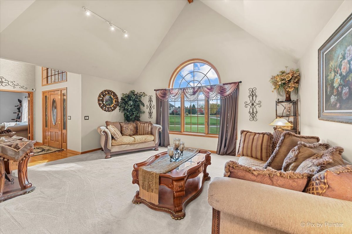 7203 Edgewood Court Spring Grove, IL 60081 - Photo 4 of 46 a living room with furniture and a large window