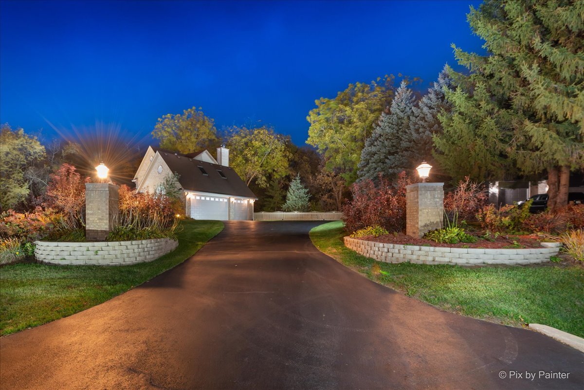 7203 Edgewood Court Spring Grove, IL 60081 - Photo 42 of 46 a front view of a house with a yard