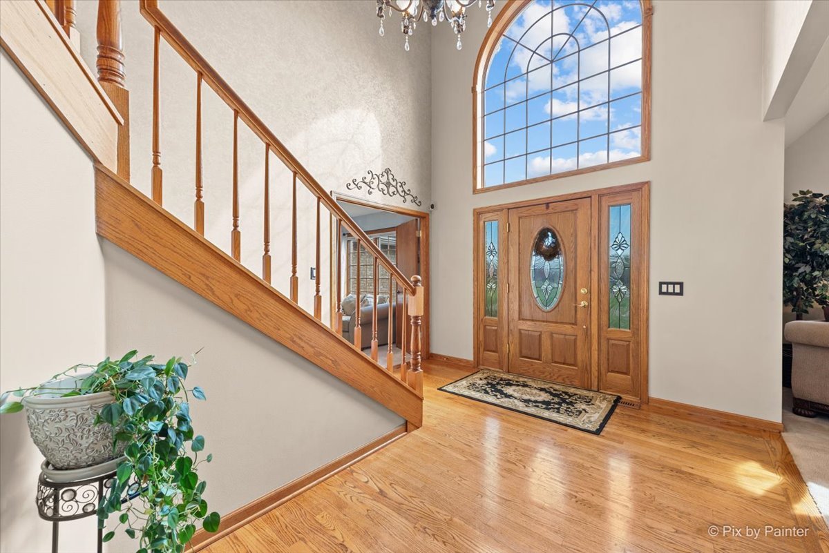 7203 Edgewood Court Spring Grove, IL 60081 - Photo 5 of 46 a view of an entryway with flower pots