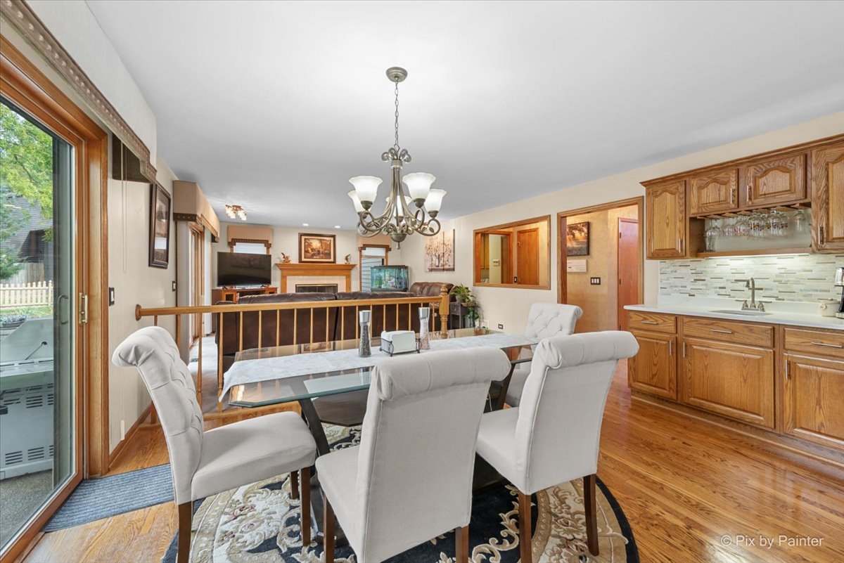 7203 Edgewood Court Spring Grove, IL 60081 - Photo 10 of 46 a view of a dining room with furniture window and wooden floor