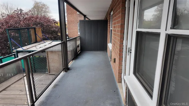 a utility room with dryer washer and a view of kitchen